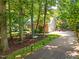 Charming two-story home with brick accents, mature trees, and a well-manicured lawn at 7401 Heartland Dr, Wake Forest, NC 27587