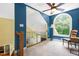 Bright hallway area with large arched window and neutral carpet, providing a welcoming transition between spaces at 7401 Heartland Dr, Wake Forest, NC 27587