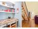 Cozy office nook with built-in desk and shelving, adjacent to a wooden staircase at 7401 Heartland Dr, Wake Forest, NC 27587