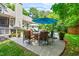 Outdoor patio featuring a dining set, grill, and beautiful poolside views at 7401 Heartland Dr, Wake Forest, NC 27587