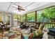 Cozy screened porch featuring comfortable wicker furniture and view of the backyard at 7401 Heartland Dr, Wake Forest, NC 27587