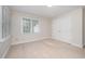 Cozy bedroom with a double door closet and large window for natural light at 7605 Sandy Lake Ct, Raleigh, NC 27613