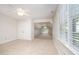 Bright bonus room with built-in storage and natural light from the large arched window at 7605 Sandy Lake Ct, Raleigh, NC 27613
