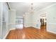 Dining room displaying open floor plan, hardwood floors, and natural light at 7605 Sandy Lake Ct, Raleigh, NC 27613