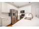 Updated kitchen showcasing stainless steel appliances and white subway tile backsplash at 7605 Sandy Lake Ct, Raleigh, NC 27613
