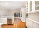 Spacious white kitchen with stainless steel appliances and hardwood flooring at 7605 Sandy Lake Ct, Raleigh, NC 27613