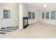 Cozy living room with a fireplace, neutral carpet, and ample natural light at 7605 Sandy Lake Ct, Raleigh, NC 27613