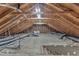 Unfinished attic featuring exposed wood beams, ductwork, and visible insulation at 8121 Bentwood Pl, Raleigh, NC 27615