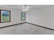 Bedroom with neutral carpet, ceiling fan and two windows with view at 8121 Bentwood Pl, Raleigh, NC 27615