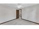 Bedroom with neutral carpet, door and view to hallway at 8121 Bentwood Pl, Raleigh, NC 27615