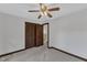 Bedroom with wood trim, carpet, closet and view to hallway at 8121 Bentwood Pl, Raleigh, NC 27615