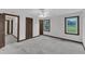 Bedroom with neutral carpet, two doors and window with view at 8121 Bentwood Pl, Raleigh, NC 27615