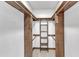 Walk-in closet featuring custom wooden organizers and ladder at 8121 Bentwood Pl, Raleigh, NC 27615