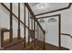 Classic foyer features carpeted stairs, wooden handrail, and white front door with decorative glass at 8121 Bentwood Pl, Raleigh, NC 27615