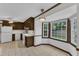 Eat-in kitchen with tile flooring, white appliances, and a window overlooking the lush backyard at 8121 Bentwood Pl, Raleigh, NC 27615