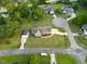Aerial view of a home with green lawn, detached garage, landscaping, and spacious circular driveway at 817 Mossy Oak Dr, Fuquay Varina, NC 27526