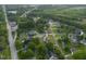 Neighborhood aerial view showcasing mature trees, community pond and landscaping in this peaceful residential community at 817 Mossy Oak Dr, Fuquay Varina, NC 27526