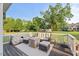 Inviting back deck featuring comfortable outdoor seating perfect for entertaining or relaxing while enjoying the view at 817 Mossy Oak Dr, Fuquay Varina, NC 27526