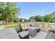 Spacious back deck offering comfortable seating with neighborhood views, perfect for outdoor gatherings and relaxation at 817 Mossy Oak Dr, Fuquay Varina, NC 27526