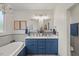 Bathroom featuring double vanity and tub at 817 Mossy Oak Dr, Fuquay Varina, NC 27526