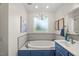 Bathroom featuring tub and single vanity at 817 Mossy Oak Dr, Fuquay Varina, NC 27526
