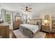 Cozy bedroom with elegant furniture and natural lighting at 817 Mossy Oak Dr, Fuquay Varina, NC 27526