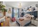Brightly lit bedroom featuring a bed and floral design elements at 817 Mossy Oak Dr, Fuquay Varina, NC 27526