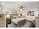 Bright bedroom with wood floors, ceiling fan, and stylish decor at 817 Mossy Oak Dr, Fuquay Varina, NC 27526