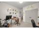 Bright, well-lit bedroom featuring a peloton bike, art and a neutral color scheme for a calm atmosphere at 817 Mossy Oak Dr, Fuquay Varina, NC 27526