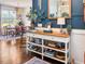 A charming entryway features a console table, elegant decor, and a glimpse into the adjacent dining area at 817 Mossy Oak Dr, Fuquay Varina, NC 27526