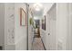 Bright hallway with wood accents, a sliding barn door and unique décor creates a warm, inviting space at 817 Mossy Oak Dr, Fuquay Varina, NC 27526