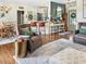 Spacious open-concept living area with hardwood floors, a dining space, and comfortable seating arrangements at 817 Mossy Oak Dr, Fuquay Varina, NC 27526