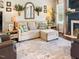Inviting living room showcasing a comfortable sofa, decorative mirror, fireplace, and stylish furnishings at 817 Mossy Oak Dr, Fuquay Varina, NC 27526