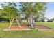 Backyard playground with swing set, slide, and playhouse, perfect for  at 817 Mossy Oak Dr, Fuquay Varina, NC 27526