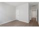 Bedroom with LVP flooring, neutral walls and a view to a hallway at 84 Black Walnut Dr # 200, Garner, NC 27529