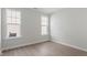 Bright bedroom with two windows and wood-look flooring at 84 Black Walnut Dr # 200, Garner, NC 27529