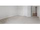 Spacious carpeted bedroom with a door to an adjacent room at 84 Black Walnut Dr # 200, Garner, NC 27529