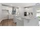Well-equipped kitchen with stainless steel appliances, white cabinetry, and a center island with quartz countertops at 84 Black Walnut Dr # 200, Garner, NC 27529