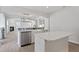 Open-concept kitchen features a center island, stainless steel appliances, and seamless flow to the living area at 84 Black Walnut Dr # 200, Garner, NC 27529