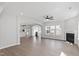 Open concept living space with a fireplace and hardwood floors that flows into a modern kitchen at 84 Black Walnut Dr # 200, Garner, NC 27529