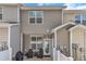 Back patio featuring a grilling area, comfortable seating, and a small table at 886 Cupola Dr, Raleigh, NC 27603