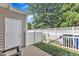 Fenced-in backyard with concrete patio, door to storage, and room for seating at 886 Cupola Dr, Raleigh, NC 27603