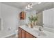 Bathroom featuring double sinks, a large mirror, and overhead lighting at 886 Cupola Dr, Raleigh, NC 27603