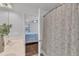 Bathroom with double sinks seen from the shower; bedroom in the background at 886 Cupola Dr, Raleigh, NC 27603