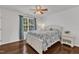 Bright bedroom with hardwood floors, white furniture, and natural light at 886 Cupola Dr, Raleigh, NC 27603