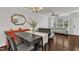 Open dining room featuring hardwood floors, modern furniture, and a ceiling fan at 886 Cupola Dr, Raleigh, NC 27603