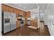 Modern kitchen equipped with stainless steel appliances, hardwood floors, and a convenient layout at 886 Cupola Dr, Raleigh, NC 27603