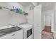 Laundry room features a modern washer and dryer and plenty of storage space at 886 Cupola Dr, Raleigh, NC 27603
