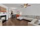 Cozy living room features a fireplace, hardwood floors, and an open layout to the dining area at 886 Cupola Dr, Raleigh, NC 27603