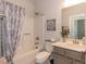Well-appointed bathroom featuring tub and shower combination, storage vanity, and stylish accents at 96 Northwood Dr, Fuquay Varina, NC 27526